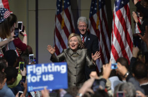 Democratic U.S. presidential candidate and former U.S. Secretary of State Hillary Clinton arrives with her husband, former U.S. President Bill Clinton (rear), to speak to supporters during her five state primary night rally held in Philadelphia, Pennsylvania , U.S., April 26, 2016.  REUTERS/Charles Mostoller - RTX2BSX6
