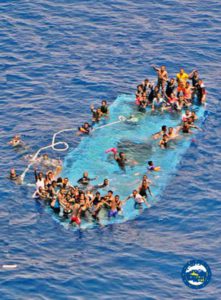 A handout picture released by the European Union Naval Force - Mediterranean (Eunavformed) on 26 May 2016 shows people in stress on their overturned boat in Canal of Sicily off the Libyan coast, 25 May 2016. The Italian navy said it had recovered five bodies from the overturned migrant ship. Over 550 migrants on board were rescued safely.  EPA/EUNAVFOR MED OHQ 