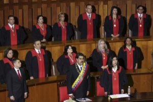 Venezuela's President Nicolas Maduro (front C) attends a ceremony to mark the opening of the judicial year at the Supreme Court of Justice (TSJ), next to Venezuela's Supreme Court President Gladys Gutierrez (front R), in Caracas, January 29, 2016. REUTERS/Marco Bello