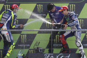Spanish Moto GP rider Jorge Lorenzo (R) of Movistar Yamaha celebrates his victory on the podium with second placed Italian team mate Valentino Rossi (L) and team boss Kouichi Tsuji  after the MotoGP race of the French motorcycling Grand Prix at Le Mans race track, Le Mans, France, 17 May 2015.  ANSA/EDDY LEMAISTRE