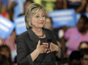 Democratic presidential candidate Hillary Clinton gestures as she "sighs" talking about Republican presidential candidate Donald Trump during a rally in Raleigh, N.C., Wednesday, June 22, 2016. (ANSA/AP Photo/Chuck Burton) 