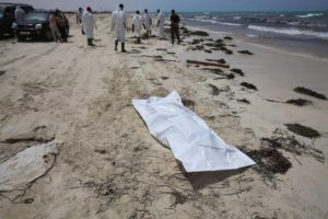 A body bag lies on the beach as rescue personnel work where bodies of migrants washed up, in Zuwarah, west of Tripoli, Libya, 02 June 2016 EPA/MOHAME BEN KHALIFA 