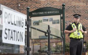 A police officer stands outside a polling station being used in the EU referendum at Birstall library, West Yorkshire, England Thursday June 23, 2016 near to where Labour MP Jo Cox was attacked and killed outside her constituency surgery. (Danny Lawson/PA via AP) 