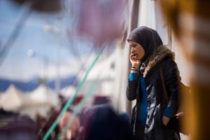 A migrant woman uses her mobile phone at the refugee camp of Idomeni, near the Greek border with Macedonia, in northern Greece, 08 March 2016. EPA/Zoltan Balogh 
