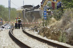 The trains wreckage are removed at the site of the head-on commuter train collision that occurred Tuesday between the towns of Andria and Corato, in the southern Puglia region, Italy, 13 July 2016. ANSA/ GAETANO LO PORTO