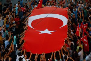 People gather at a pro-government rally in central Istanbul's Taksim square, Saturday, July 16, 2016. (ANSA/AP Photo/Emrah Gurel)