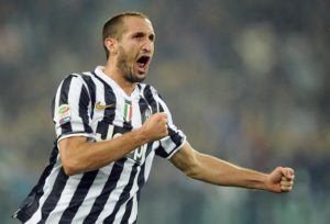 Juventus defender Giorgio Chiellini celebrates after scoring the 3-1 lead during the Serie A soccer match between Juventus and AC Milan at the Juventus stadium in Turin, Italy, 6 October 2013. ANSA/DI MARCO