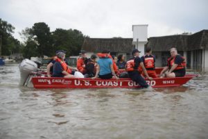 A handout picture provided by the US Coast Guard on 16 August 2016 shows members of the Coast Guard rescuing residents, during the flooding in Baton Rouge, Louisiana, USA, 14 August 2016. At least six people died and over 20,000 people had to be evacuated from their homes as 'historic' flooding hits large parts of Louisiana, media reported.  EPA/BRANDON GILES/US COAST GUARD/HANDOUT  