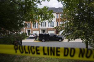 Law enforcement officers park outside the home of DC Metro Transit police officer Nicholas Young, who the FBI arrested and charged with providing assistance to the so-called Islamic State (IS) earlier in the day, in Fairfax, Virginia, USA, 03 August 2016. Young was under surveillance for six years.  EPA/JIM LO SCALZO