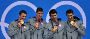 The US team with Michael Phelps (R-L), Ricky Berens, Conor Dwyer and Ryan Lochte celebrate after winning gold in the Men's 4x200m Freestyle Relay Final during the London 2012 Olympic Games Swimming competition, London, Britain, 31 July 2012.  EPA/HANNIBAL