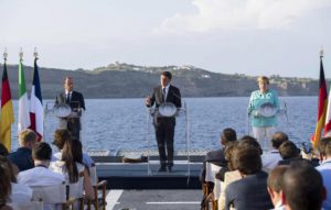 A handout picture made available by Chigi Palace Press Office on 22 August 2016 shows Italian Prime Minister Matteo Renzi (C), French President Francois Hollande (L) and German Chancellor Angela Merkel, during a press conference at the end of their meeting on the Italian military ship 'Garibaldi' near Ventotene Island, Tirreno sea, Italy, 22 August 2016.  EPA/TIBERIO BARCHIELLI / CHIGI PALACE PRESS OFFICE /