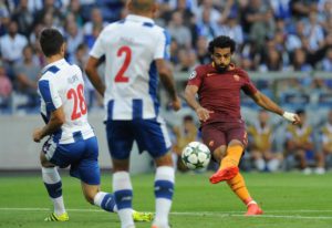 Roma's Mohamed Salah, right, attempts a shot at goal past Porto's Felipe, left, during a Champions League play-offs first leg soccer match between FC Porto and AS Roma at the Dragao stadium in Porto, Portugal, Wednesday, Aug. 17, 2016. (ANSA/AP Photo/Paulo Duarte)