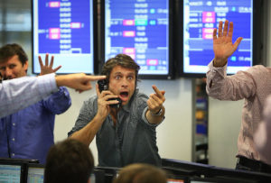 LONDON - OCTOBER 09:  A broker on ICAP's dealing floor calls for prices on October 9, 2008 in London.  Share prices are up on the day as markets react to the interest rate cut.  (Photo by Peter Macdiarmid/Getty Images)
