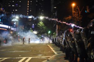 Tear gas is used as protesters confront riot police officers in Charlotte, North Carolina, USA, 21 September 2016. EPA/CAITLIN PENNA