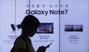 A woman walks by an advertisement of Samsung Electronics Galaxy Note 7 smartphone at the company's showroom in Seoul, South Korea, Friday, Sept. 2, 2016.  (ANSA/AP Photo/Ahn Young-joon) 