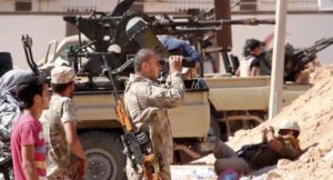 This image Tuesday, June 14, 2016 made from Associated Press video shows, Armed Misrata fighters loyal to the unity government on the main street of Sirte. (AP Video via AP)