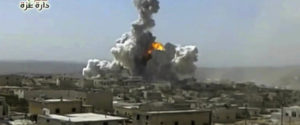 In this still image taken from video footage provided by the Daret Izza Media Office, an anti-government activist group, which has been authenticated based on its contents and other AP reporting, a big blast is seen at the edge of the city accompanied by a large plume of smoke and debris rising from the skyline, Daret Izza, Syria, Tuesday, Oct. 4, 2016.  (Daret Izza Media Office via AP)