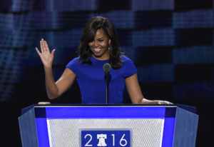 US First Lady Michelle Obama gestures during Day 1 of the Democratic National Convention at the Wells Fargo Center in Philadelphia, Pennsylvania, July 25, 2016. / AFP PHOTO / SAUL LOEB ------------------------------------------------------------------------------------------
