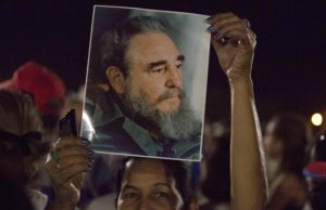 A woman holds a picture of late Fidel Castro during a rally at Revolution Plaza in Havana, Cuba, Tuesday, Nov. 29, 2016.  (ANSA/AP Photo/Desmond Boylan) -------------------------------------------------------------------------------------------
