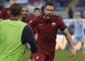 Roma's Kevin Strootman celebrates after scoring during a Serie A soccer match between Lazio and Roma, at the Rome Olympic stadium Sunday, Dec. 4, 2016. (ANSA/AP Photo/Gregorio Borgia)