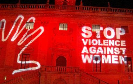 La facciata di Palazzo Senatorio in Campidoglio illuminata di rosso e con la scritta ''Stop violence against women' in occasione della giornata internazionale contro la violenza sulle donne