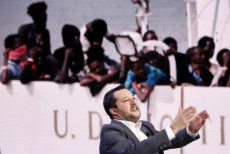 Matteo Salvini, vice premier e ministro dell'Interno, durante la trasmissione televisiva 'Porta a Porta' in onda su Rai Uno. Alle sue spalle un'immagine dei migranti sulla Diciotti.