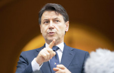 Il Presidente del Consiglio durante una conferenza stampa. a Piacenza.