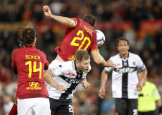Federico Fazio colpisce di testa un pallone superando al difensore del Parma Riccardo Gagliolo.